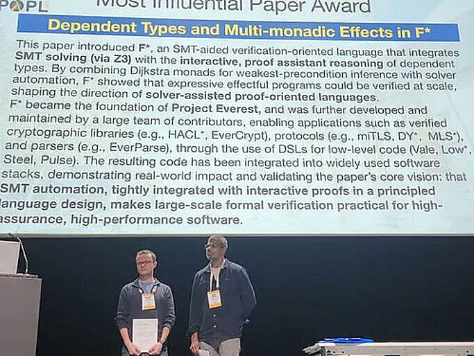 Cătălin Hrițcu (left) and Nikhil Swamy (right) at the award ceremony for the 2026 Most Influential POPL Paper Award © Tahina Ramananandro